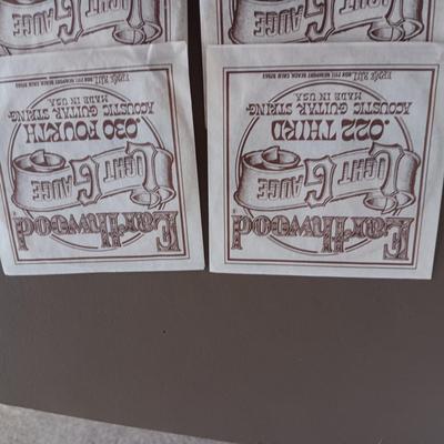 VARIETY OF GUITAR STRINGS AND A PICK
