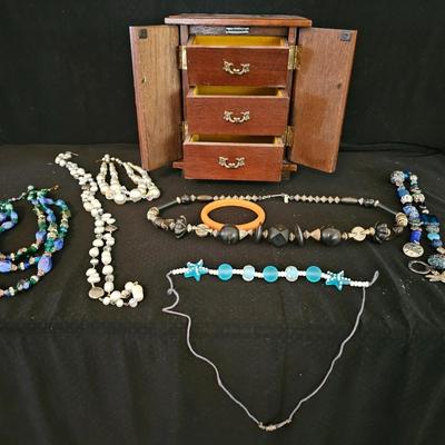 Nice musical wooden Jewlery box with an assortment of Jewlery