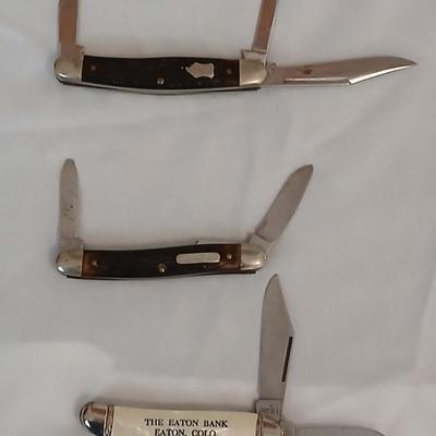 Collection of small vintage pocket knives - Eaton bank