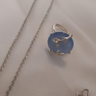 Vintage AVON Moon Shimmer ring with silver toned clip on earrings and two necklaces