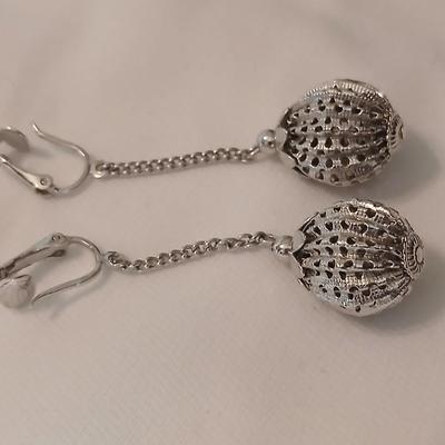 Two women's rings, a necklace and earrings - all silver-toned