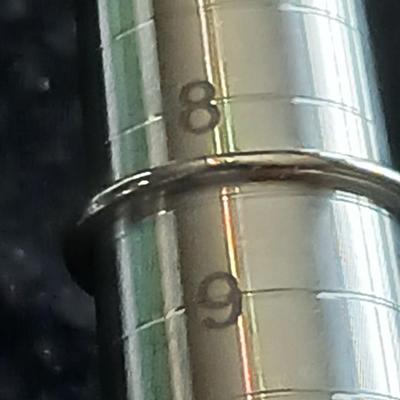 Two women's rings, a necklace and earrings - all silver-toned