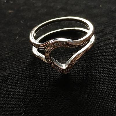 Two women's rings, a necklace and earrings - all silver-toned