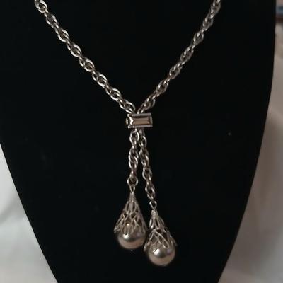 Two women's rings, a necklace and earrings - all silver-toned