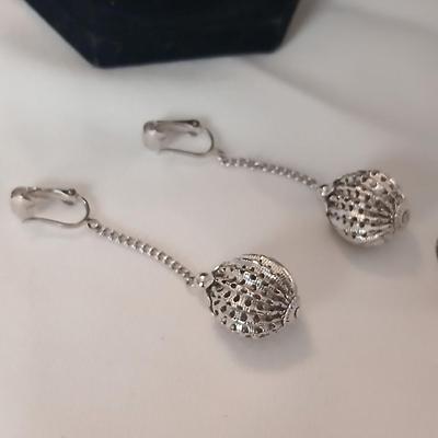 Two women's rings, a necklace and earrings - all silver-toned