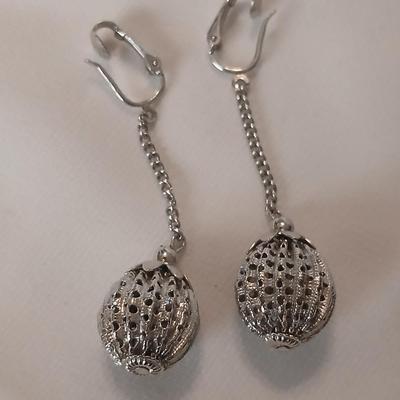 Two women's rings, a necklace and earrings - all silver-toned