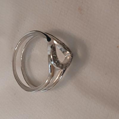 Two women's rings, a necklace and earrings - all silver-toned