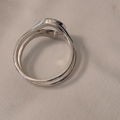 Two women's rings, a necklace and earrings - all silver-toned