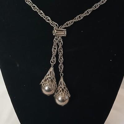 Two women's rings, a necklace and earrings - all silver-toned