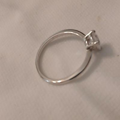 Two women's rings, a necklace and earrings - all silver-toned