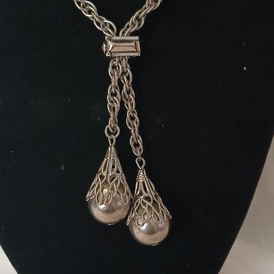 Two women's rings, a necklace and earrings - all silver-toned