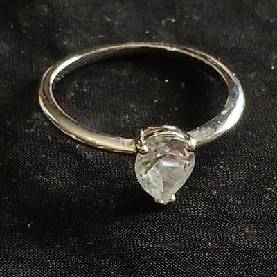 Two women's rings, a necklace and earrings - all silver-toned