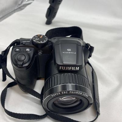 FUJI DIGITAL CAMERA IN A CASE AND A TRIPOD