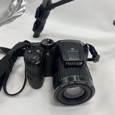 FUJI DIGITAL CAMERA IN A CASE AND A TRIPOD