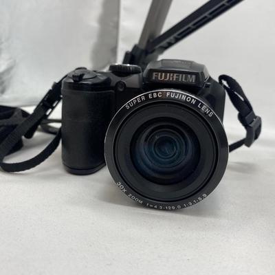 FUJI DIGITAL CAMERA IN A CASE AND A TRIPOD