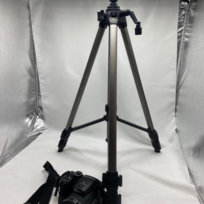 FUJI DIGITAL CAMERA IN A CASE AND A TRIPOD