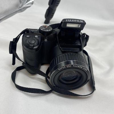 FUJI DIGITAL CAMERA IN A CASE AND A TRIPOD