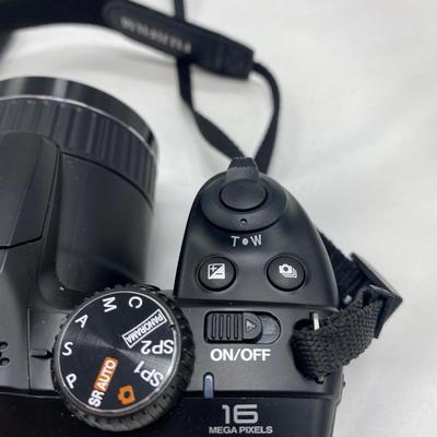 FUJI DIGITAL CAMERA IN A CASE AND A TRIPOD