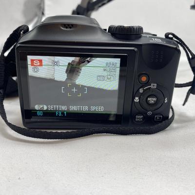 FUJI DIGITAL CAMERA IN A CASE AND A TRIPOD