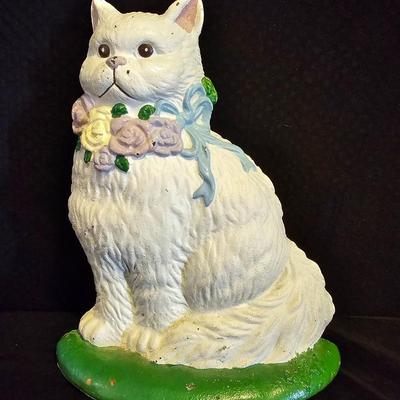 Cast Iron Cat door stop, Cat-stained glass suncatcher and a wooden kitty with a long tail