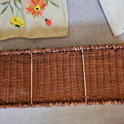 Four Vintage Crewel Embroidery Pillowcases with a variety of wicker baskets and a framed floral embroidered wall art