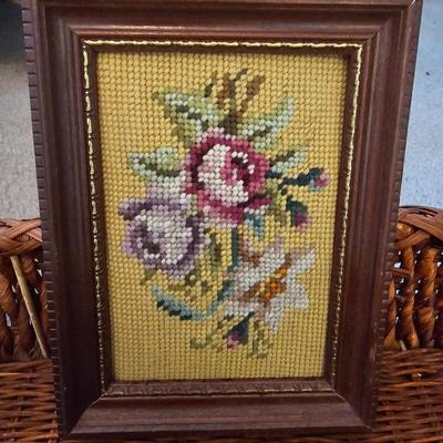 Four Vintage Crewel Embroidery Pillowcases with a variety of wicker baskets and a framed floral embroidered wall art