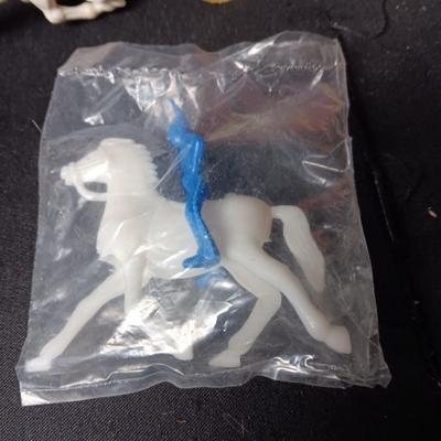 A VARIETY OF VINTAGE TOY COWBOYS AND MORE