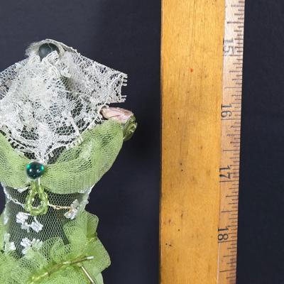 LOT 285: Star Style at the Academy Awards Book, Frames, and Set of Four Victorian Style Dress Miniatures