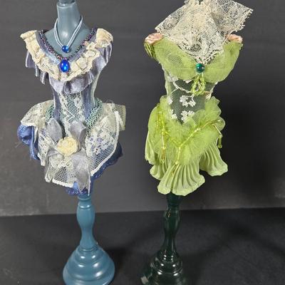 LOT 285: Star Style at the Academy Awards Book, Frames, and Set of Four Victorian Style Dress Miniatures