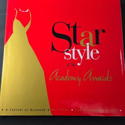 LOT 285: Star Style at the Academy Awards Book, Frames, and Set of Four Victorian Style Dress Miniatures