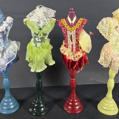 LOT 285: Star Style at the Academy Awards Book, Frames, and Set of Four Victorian Style Dress Miniatures