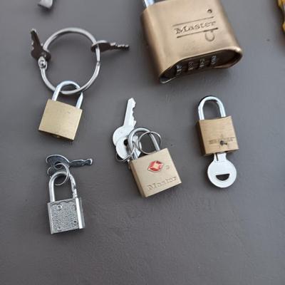 PADLOCKS, POCKET KNIVES AND TRAVEL CLOCK