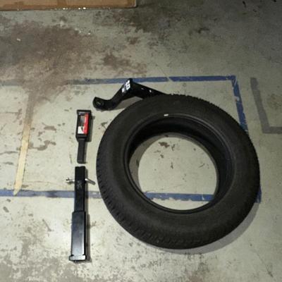 1 1/4" - 2" HITCH ADAPTER, 1 YOKOHAMA 225/65R17 TIRE AND A HITCH