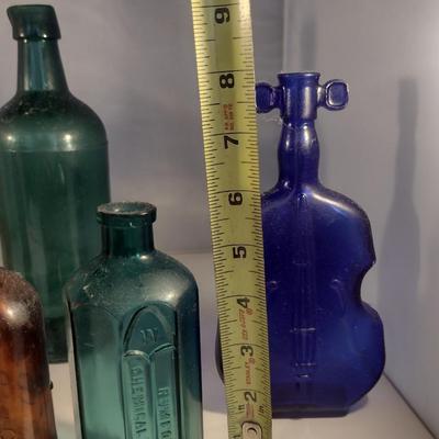 Collection of Vintage Glass Bottles- Clear, Blue, Green, and Amber