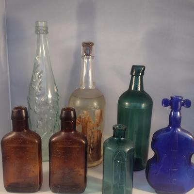 Collection of Vintage Glass Bottles- Clear, Blue, Green, and Amber