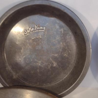 Collection of Vintage Metal Pie Pans and Tin Cans