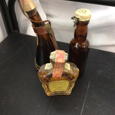 Glass Perfume, crown Royal,and Whiskey.