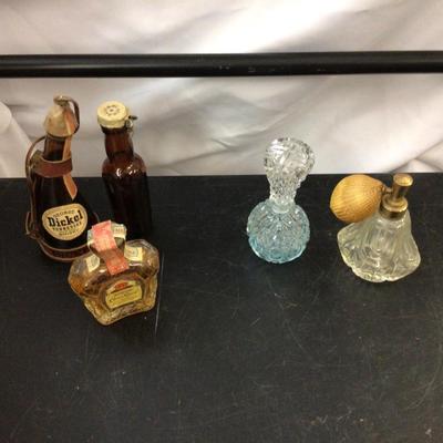 Glass Perfume, crown Royal,and Whiskey.