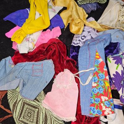 Huge lot of vintage Barbie clothes and a modeling stand for clothing Mattel