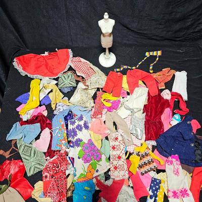 Huge lot of vintage Barbie clothes and a modeling stand for clothing Mattel