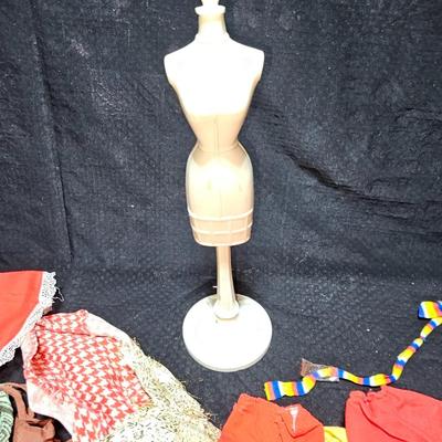 Huge lot of vintage Barbie clothes and a modeling stand for clothing Mattel