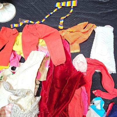 Huge lot of vintage Barbie clothes and a modeling stand for clothing Mattel