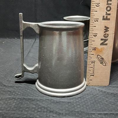 Four Pewter Collectible Beer Steins - One with a bell in the bottom.