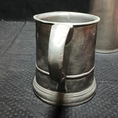 Four Pewter Collectible Beer Steins - One with a bell in the bottom.