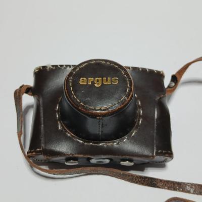 Vintage Argus C-Twenty 35mm camera with case and some film and flash extension