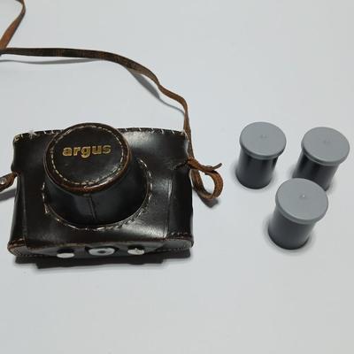 Vintage Argus C-Twenty 35mm camera with case and some film and flash extension