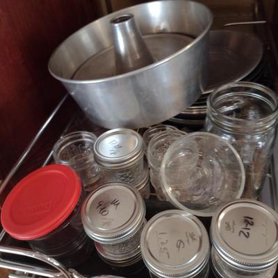 Contents of Cabinet- Bakeware, Assorted Kitchen Items, Storage Tins, Jars, etc.
