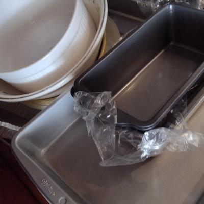 Contents of Cabinet- Bakeware, Assorted Kitchen Items, Storage Tins, Jars, etc.