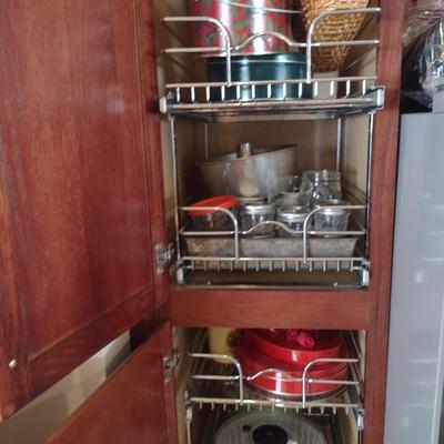 Contents of Cabinet- Bakeware, Assorted Kitchen Items, Storage Tins, Jars, etc.