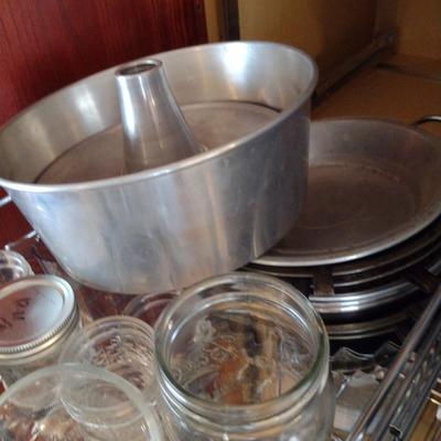 Contents of Cabinet- Bakeware, Assorted Kitchen Items, Storage Tins, Jars, etc.